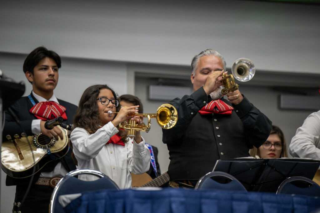 A Mariachi Band, including adults and students, plays.