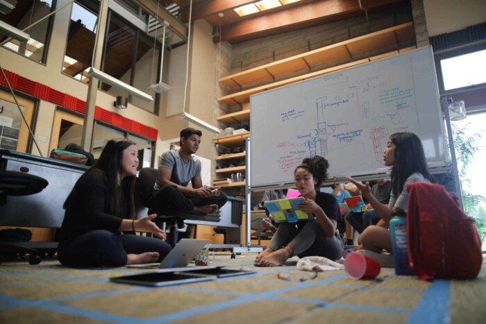 Nalukai Students sit and work on a real-world problem