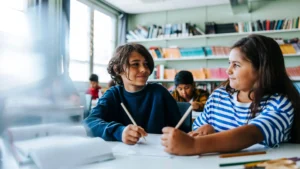 Image of two students in a classroom.